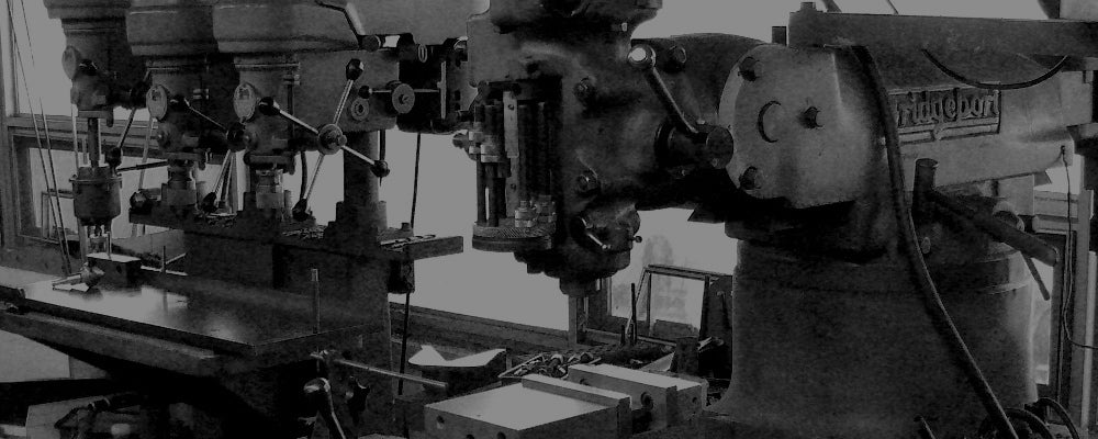 Industrial machine with various components in a workshop setting